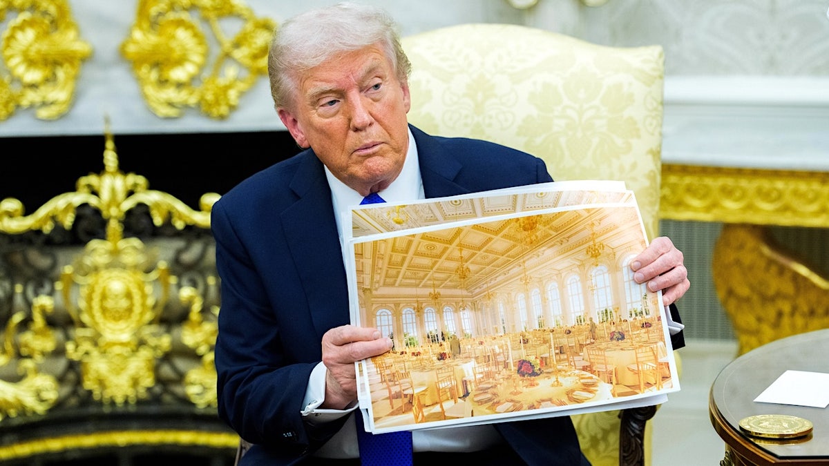 President Donald Trump holds model of the $400 million white house ballroom