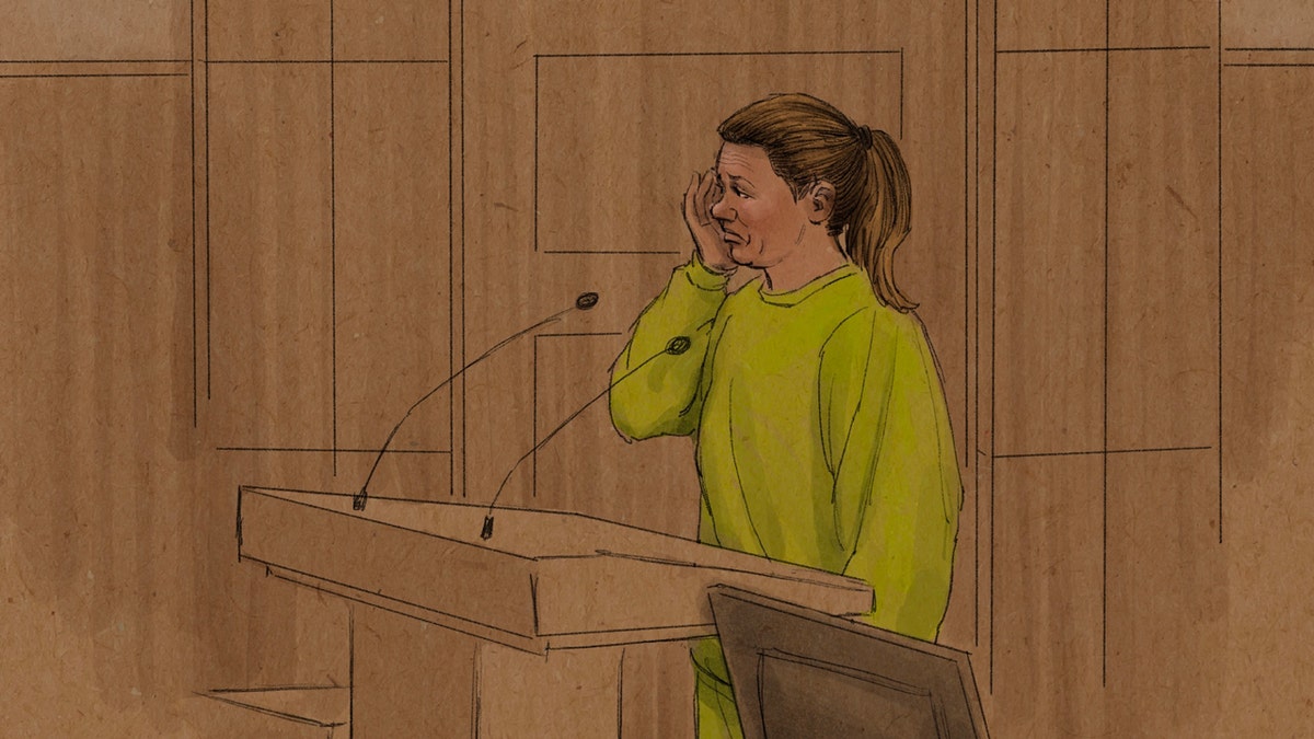 Aimee Bock wiping tears from her face in a federal courtroom sketch.