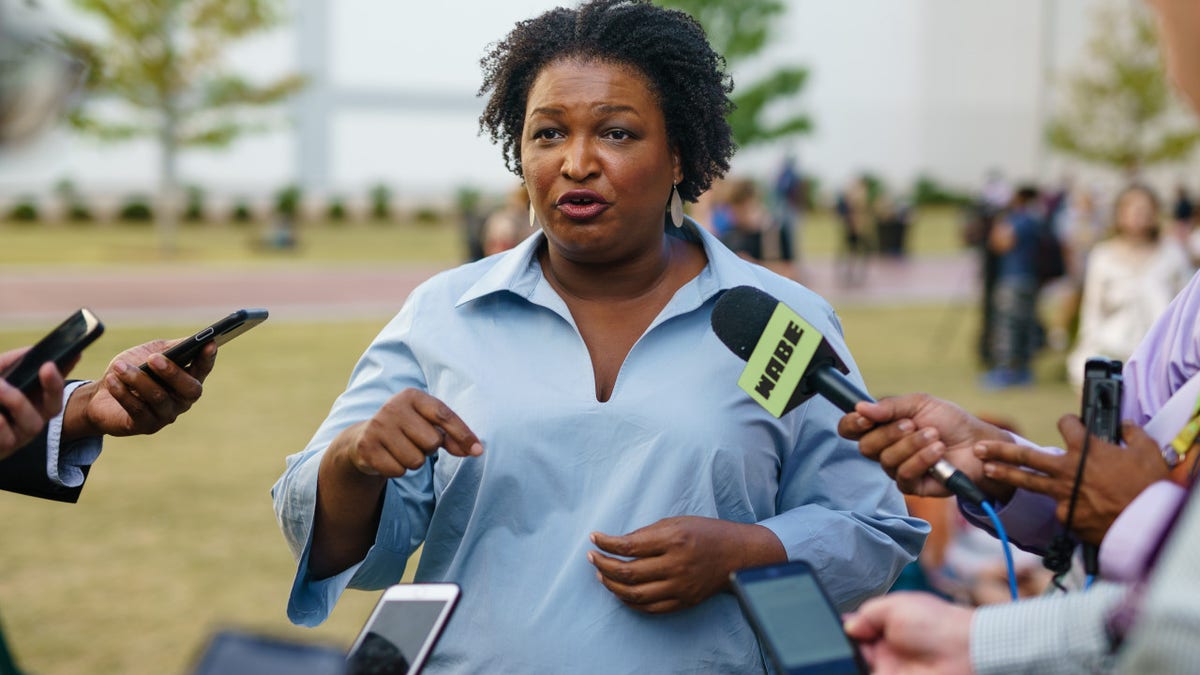 Stacey Abrams speaking to reporters at Georgia State University in Atlanta