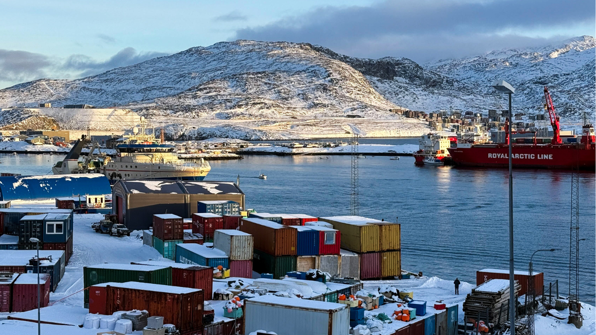A view of a port in Greenland with buildings and water