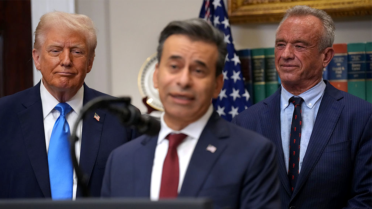 President Donald Trump and Health and Human Services Secretary Robert F. Kennedy Jr. looking on as FDA Commissioner Dr. Marty Makary speaks in the White House Roosevelt Room