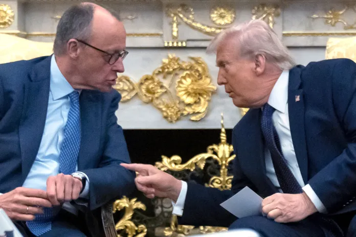 President Donald Trump, right, talks with German Chancellor Friedrich Merz