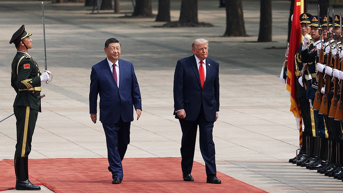 U.S. President Donald Trump and Chinese President Xi Jinping reviewing honor guard at Great Hall of the People