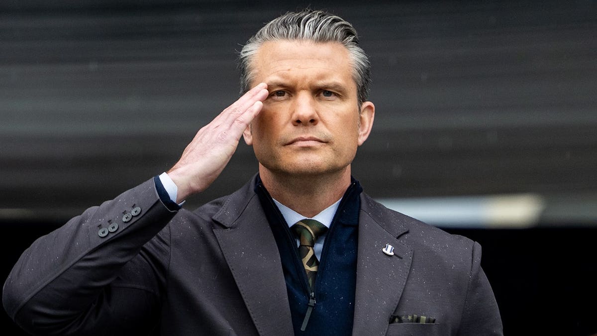 U.S. Secretary of War Pete Hegseth salutes