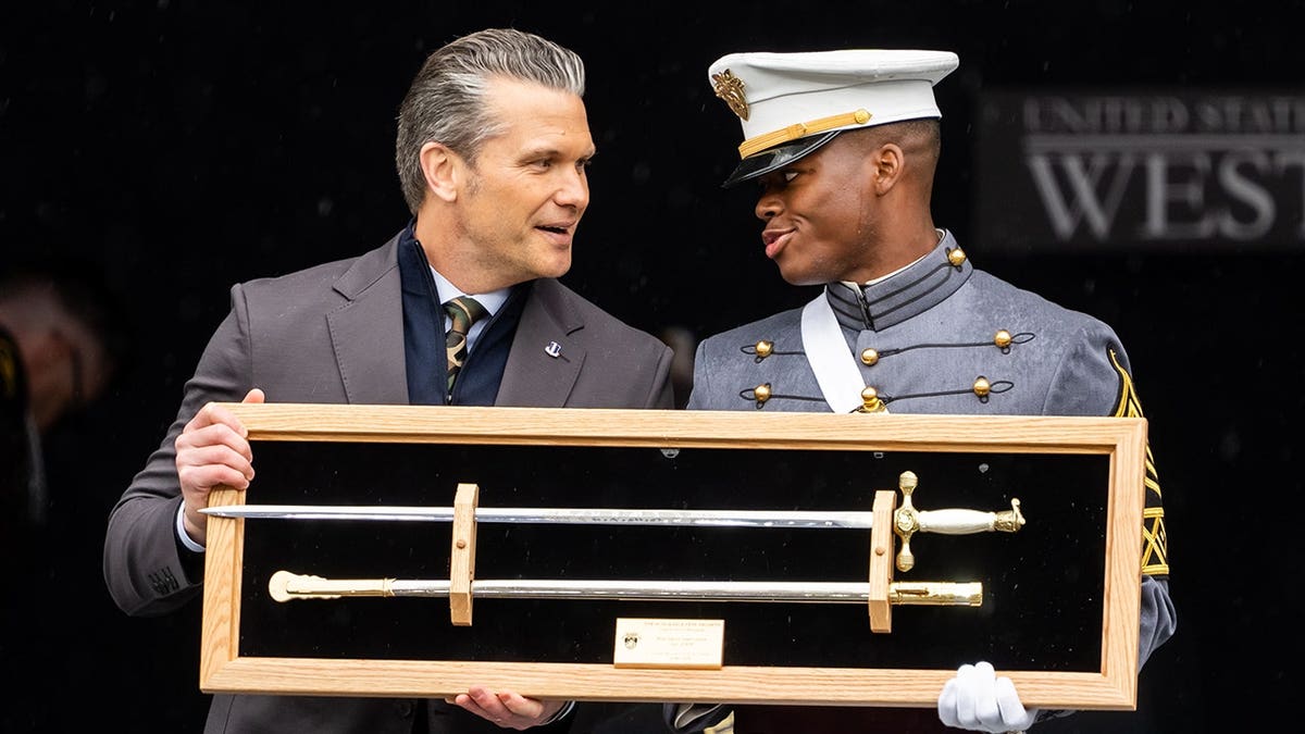 U.S. Secretary of War Pete Hegseth receives a gift