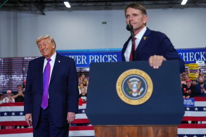 President Donald Trump listens as congressional candidate Ed Gallrein speaks at Verst Logistics Wednesday, March 11, 2026, in Hebron, Ky. 