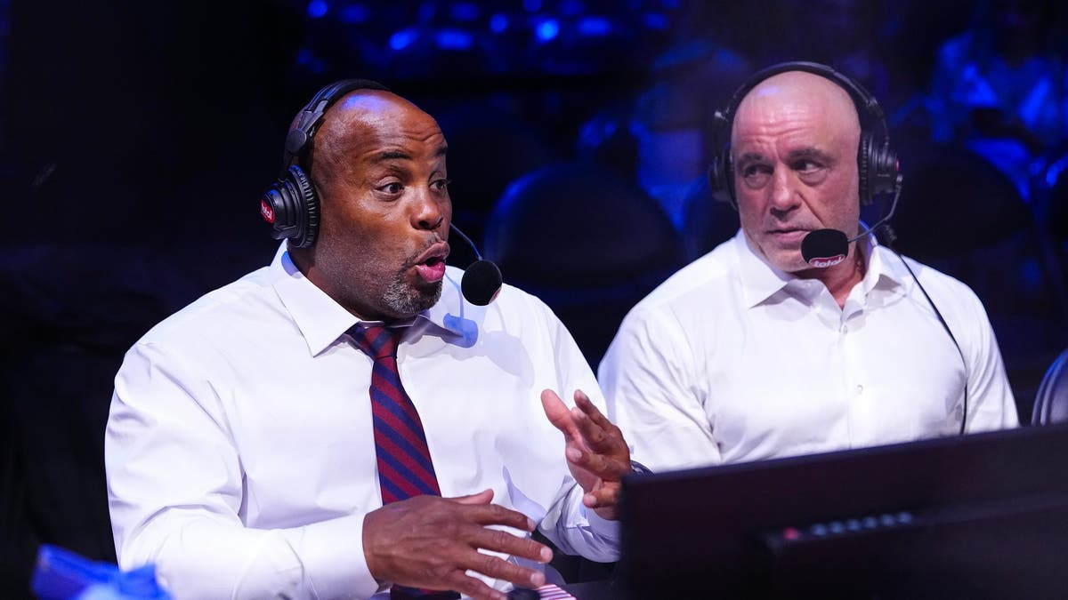Daniel Cormier and Joe Rogan standing on the South Lawn at the White House announcing fights