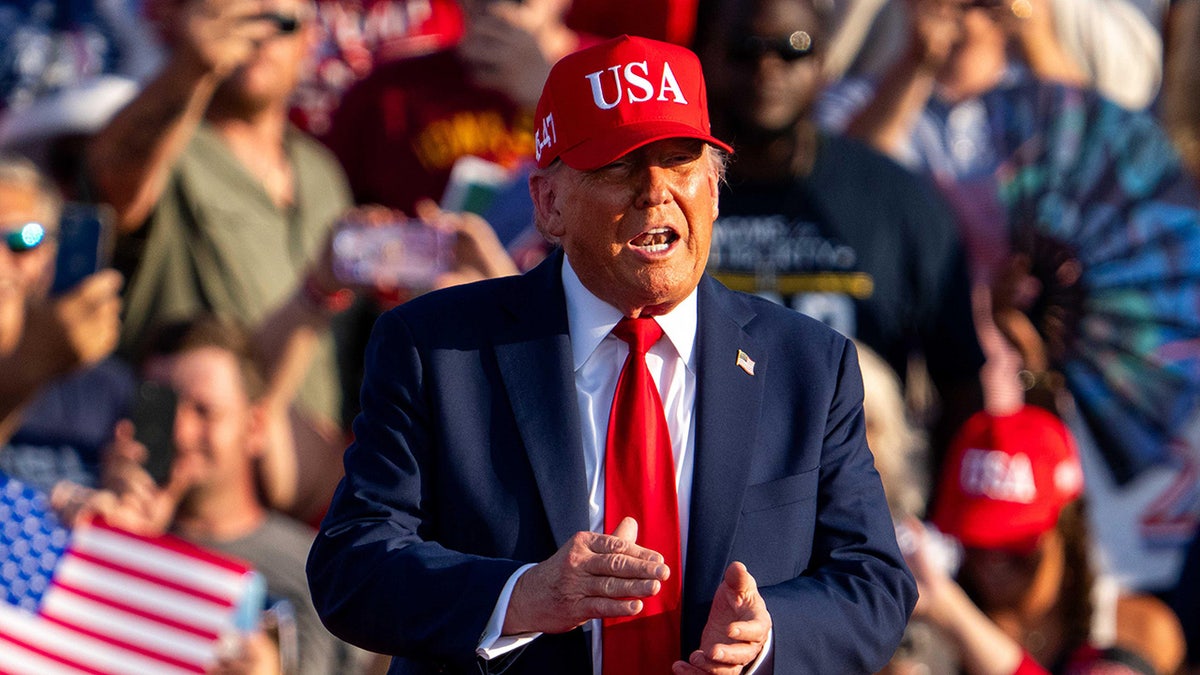 President Donald Trump taking the stage at the Iowa State Fairgrounds