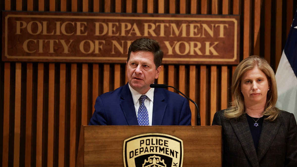 Jay Clayton speaking next to Jessica S. Tisch at New York Police Department headquarters