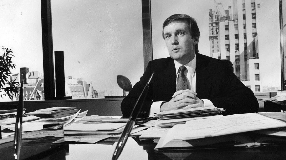 Trump in 1980s black and white photo in his real estate office