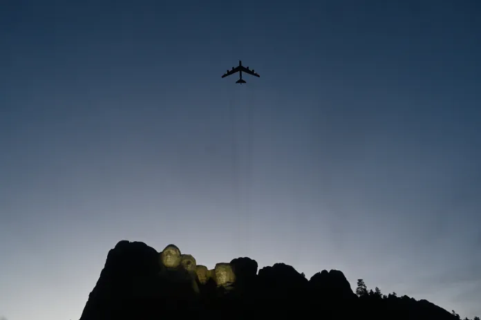 A B-52 plane performs a flyover as Interior Secretary Doug Burgum speaks before President Donald Trump at Mount Rushmore National Memorial, Friday, July 3, 2026, near Keystone, S.D.