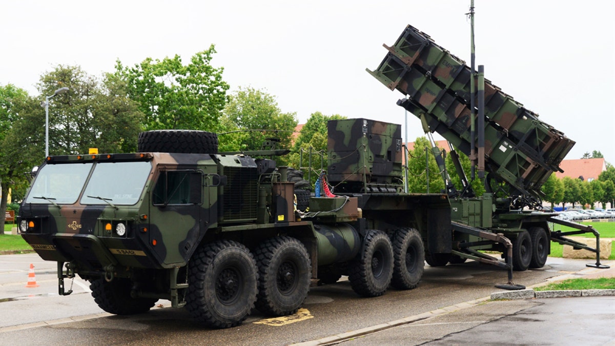 U.S. Soldiers and civilians observe a MIM-104 Patriot surface-to-air missile (SAM) systems during a static-display demonstration Aug. 15, 2019, at Katterbach Army Airfield in Ansbach, Germany. (U.S. Army photo by Charles Rosemond)
