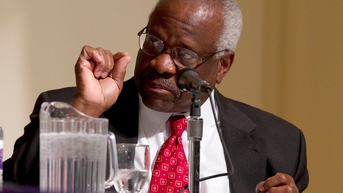 FILE - In this Jan. 26, 2012 file photo, Supreme Court Justice Clarence Thomas speaks at College of the Holy Cross in Worcester, Mass. Thomas says the Supreme Court confirmation process is an example of how the nations capital is broken in some ways. Thomas reflected Oct. 26, 2016, on his 25 years as a justice, at the Heritage Foundation, the conservative think tank where his wife once worked. (AP Photo/Michael Dwyer, File)
