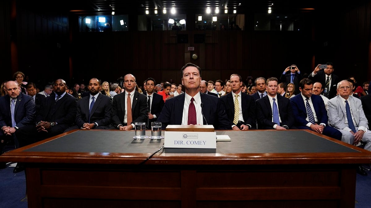 Former FBI Director James Comey testifies before a Senate Intelligence Committee hearing on Russia's alleged interference in the 2016 U.S. presidential election on Capitol Hill in Washington, U.S., June 8, 2017. REUTERS/Jonathan Ernst - HP1ED681F68T4