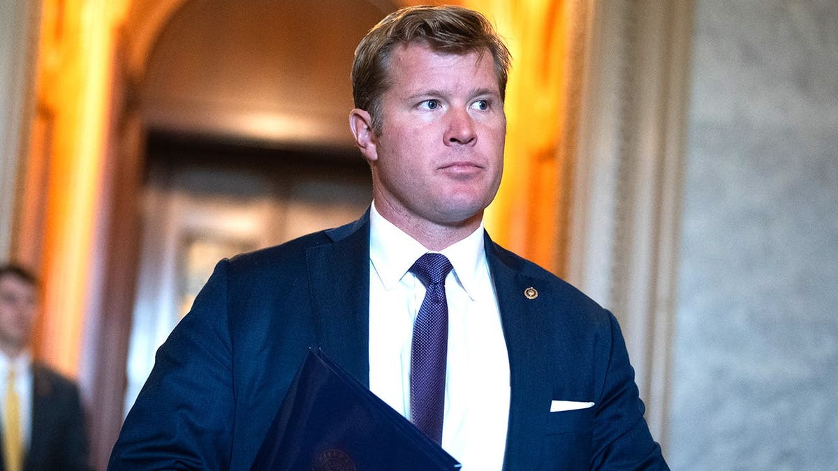 Sen. Tim Sheehy walks through U.S. Capitol during Senate votes.