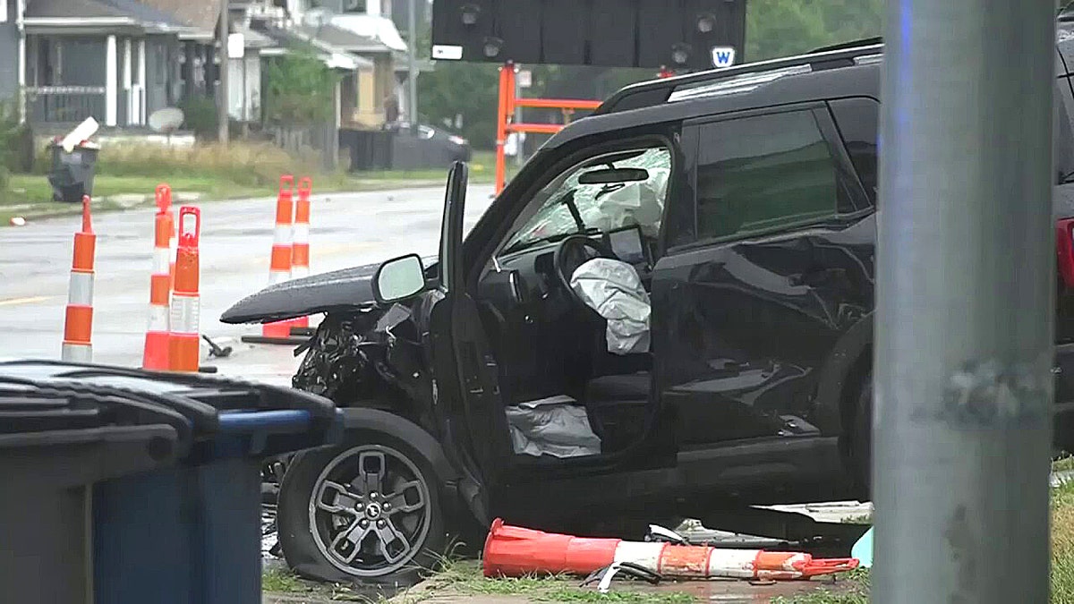 Black SUV with deployed airbag
