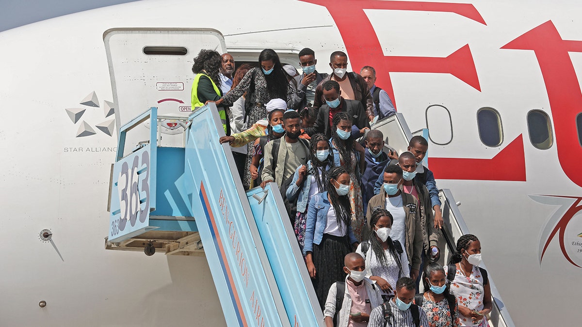 Ethiopians departing plane