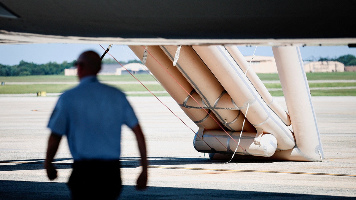 An emergency slide of Air Force One is deployed.
