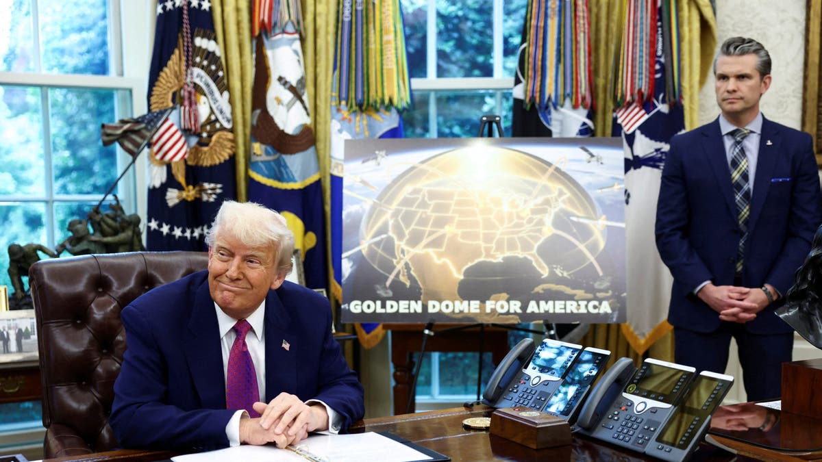 U.S. President Donald Trump makes an announcement regarding the Golden Dome missile defense shield next to U.S. Defense Secretary Pete Hegseth in the Oval Office of the White House in Washington, D.C., U.S., May 20, 2025. REUTERS/Kevin Lamarque TPX IMAGES OF THE DAY