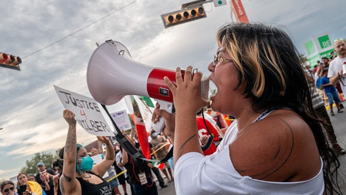 Protesters demonstrate against ICE officers in Austin, Texas.