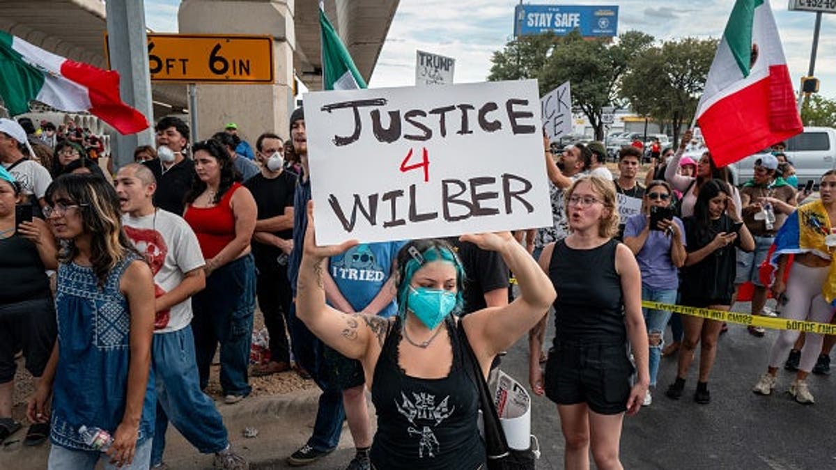 People protest against ICE officers in Austin, Texas.