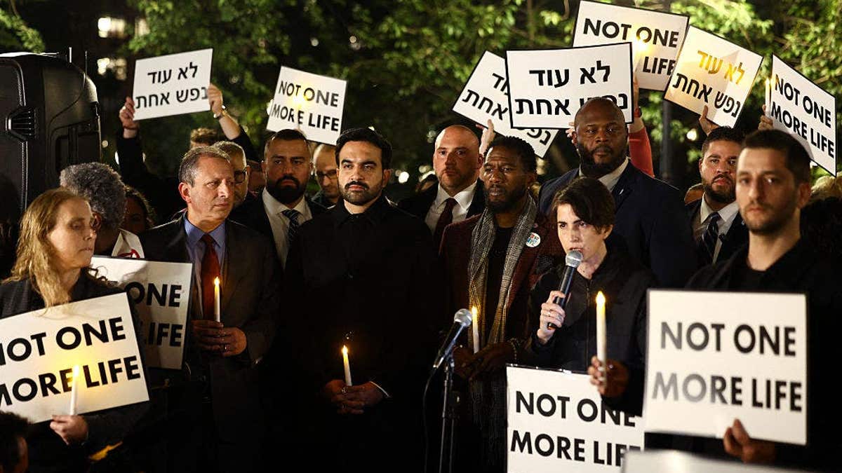 Zohran Mamdani stands during a rally in New York City