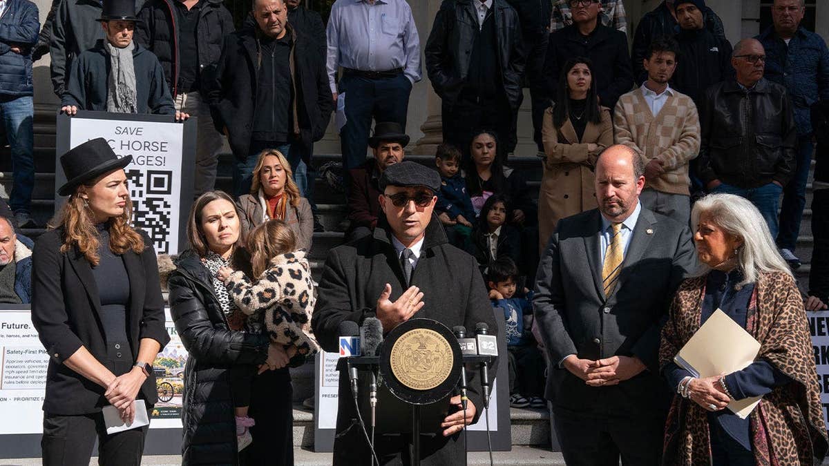 Horse carriage driver Frank Riccobono speaks at a news conference outside New York City Hall on Oct. 21, 2026